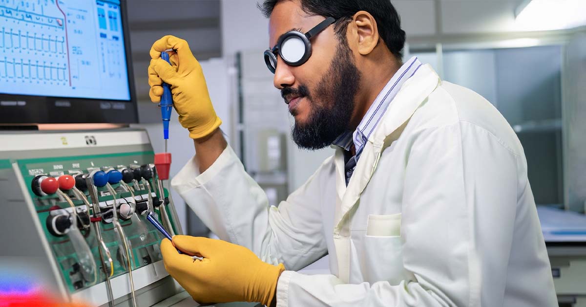 short bearded and short haired bangladeshi man inside a calibration lab in bangladesh calibrating a machine